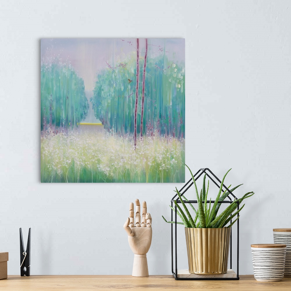 A bohemian room featuring Watercolor painting of a dream-like meadow in a forest in varies shades of green.