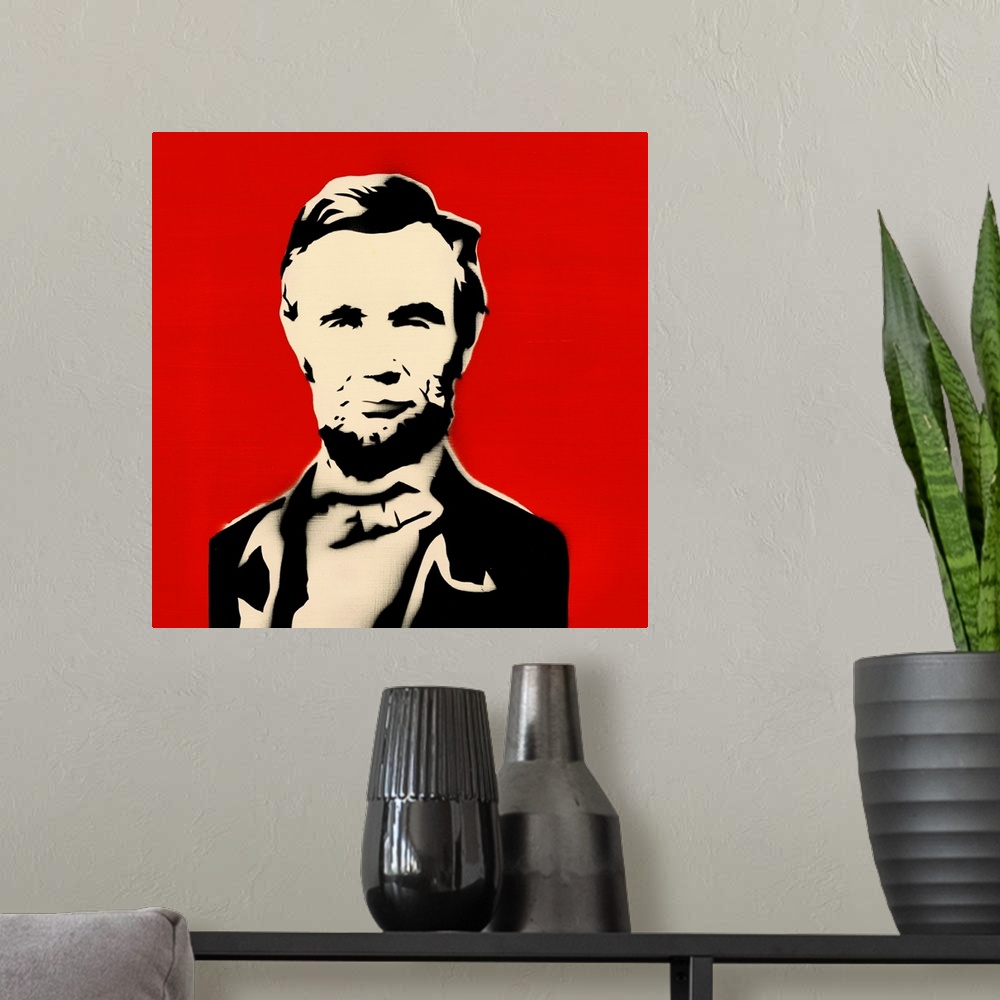 A modern room featuring Square spray art of Abraham Lincoln on a bright red background.