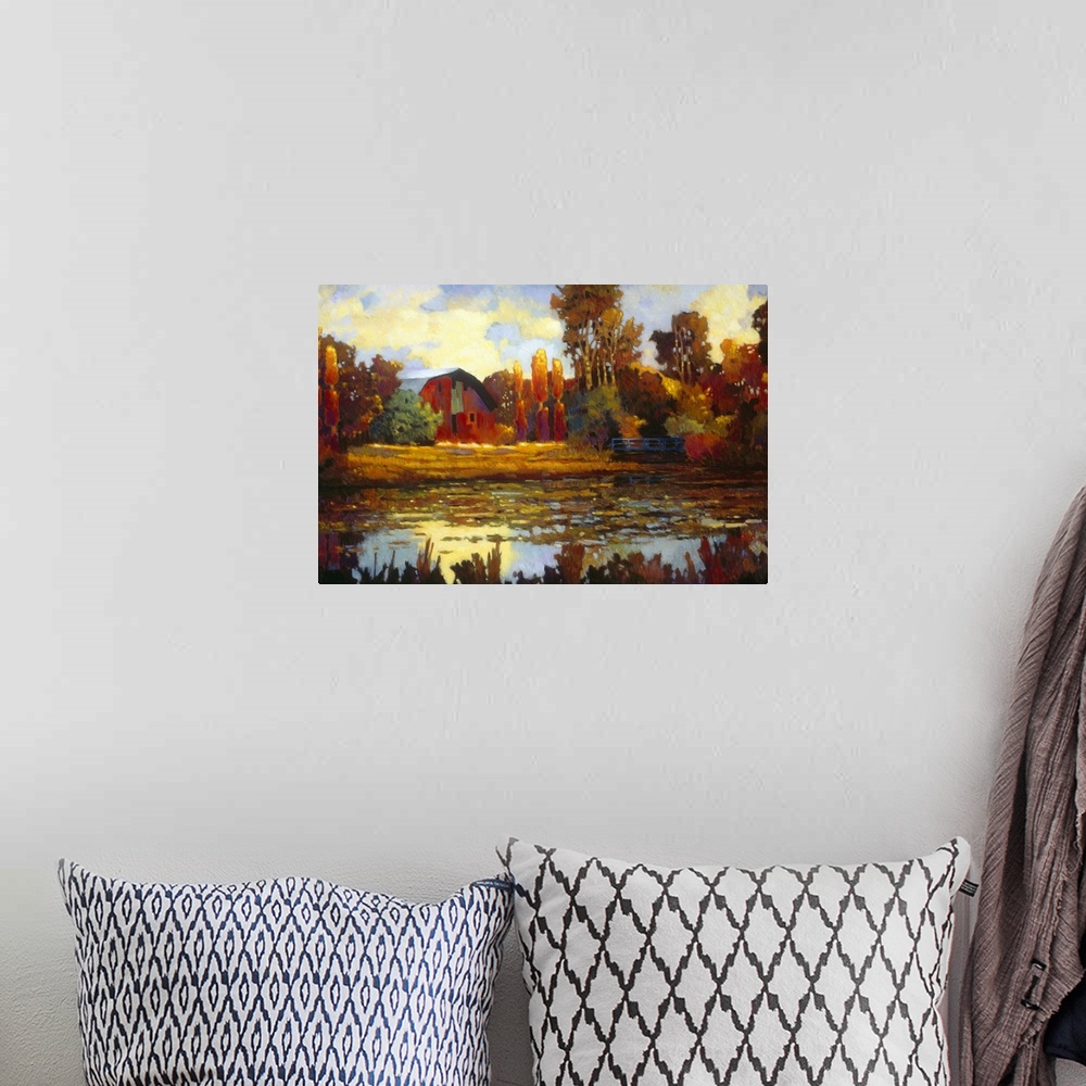 A bohemian room featuring Painting on canvas of an old barn with fall foliage around it by a lake.