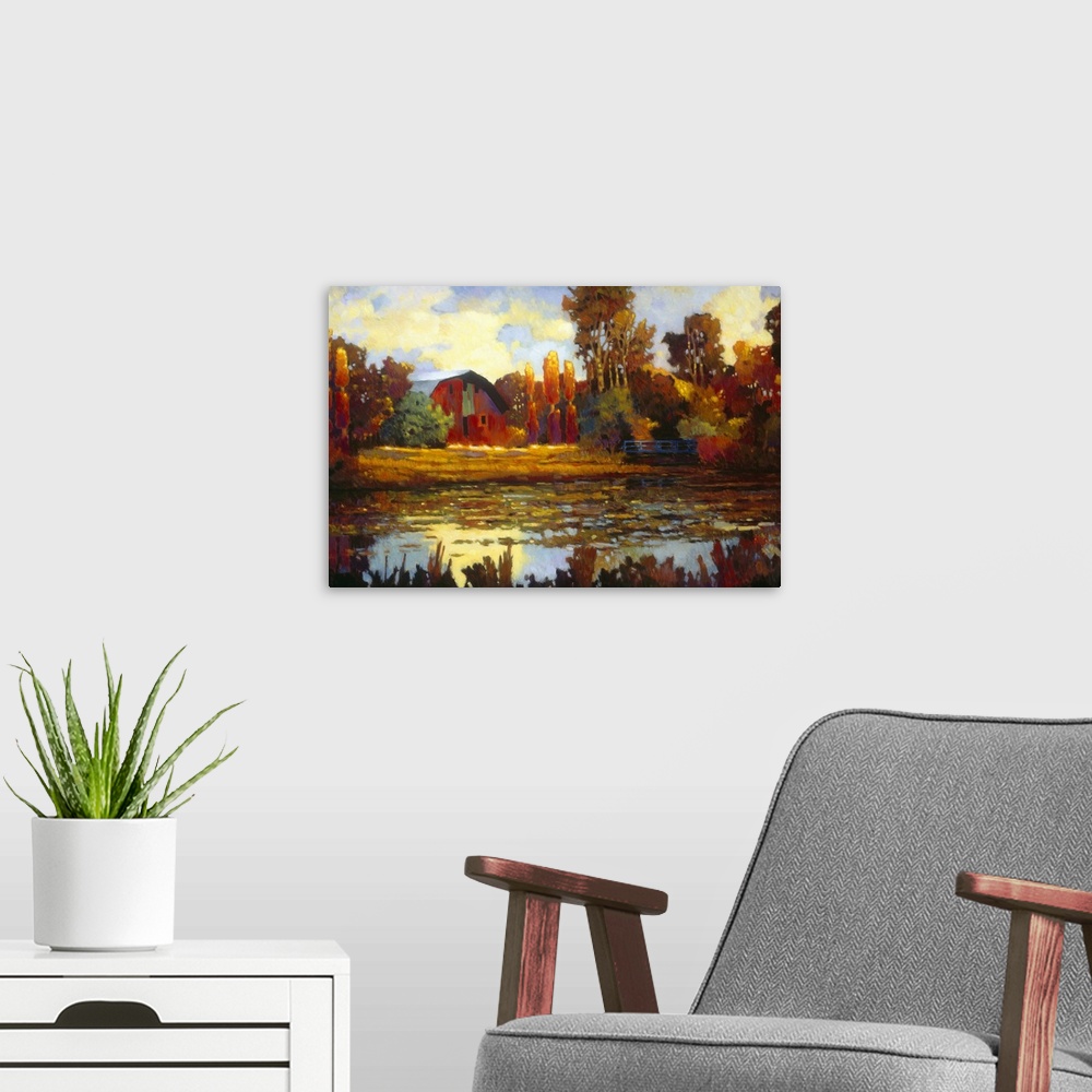 A modern room featuring Painting on canvas of an old barn with fall foliage around it by a lake.