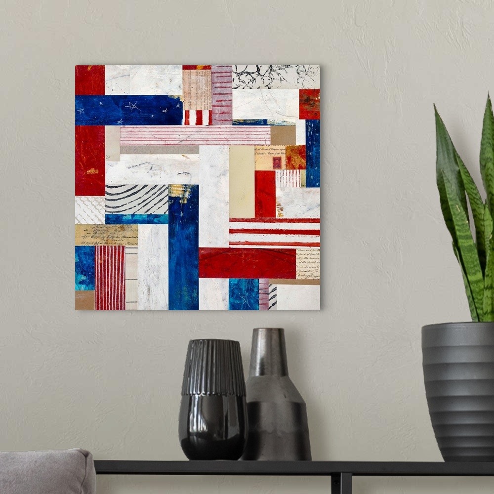 A modern room featuring Square folk art created with mixed media to resemble a red white and blue quilt pattern.