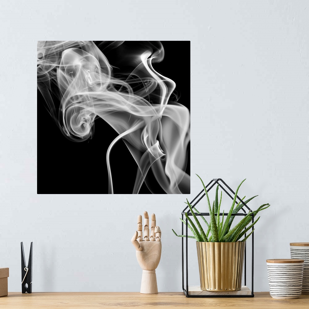 A bohemian room featuring Square, oversized, big canvas art of a large cloud of smoke swirling on a solid black background.