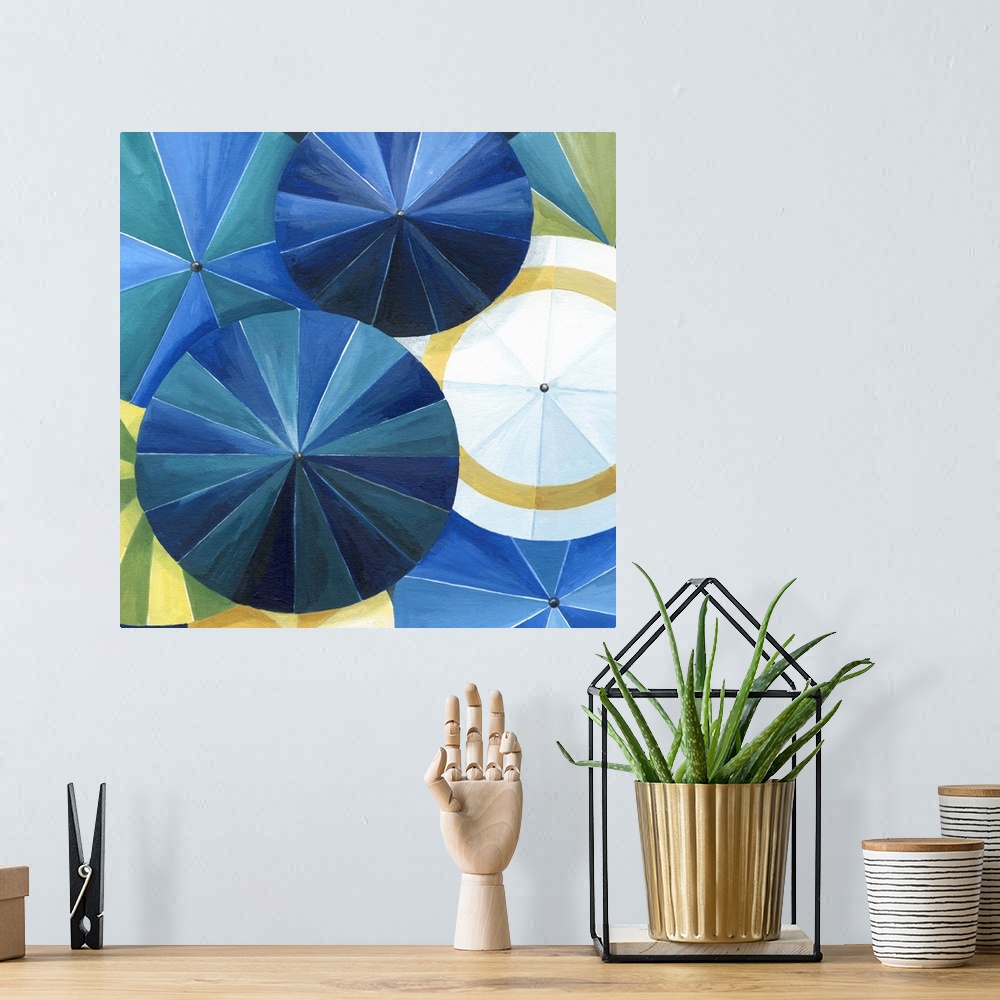 A bohemian room featuring Contemporary painting of a view of colorful umbrellas seen from above.