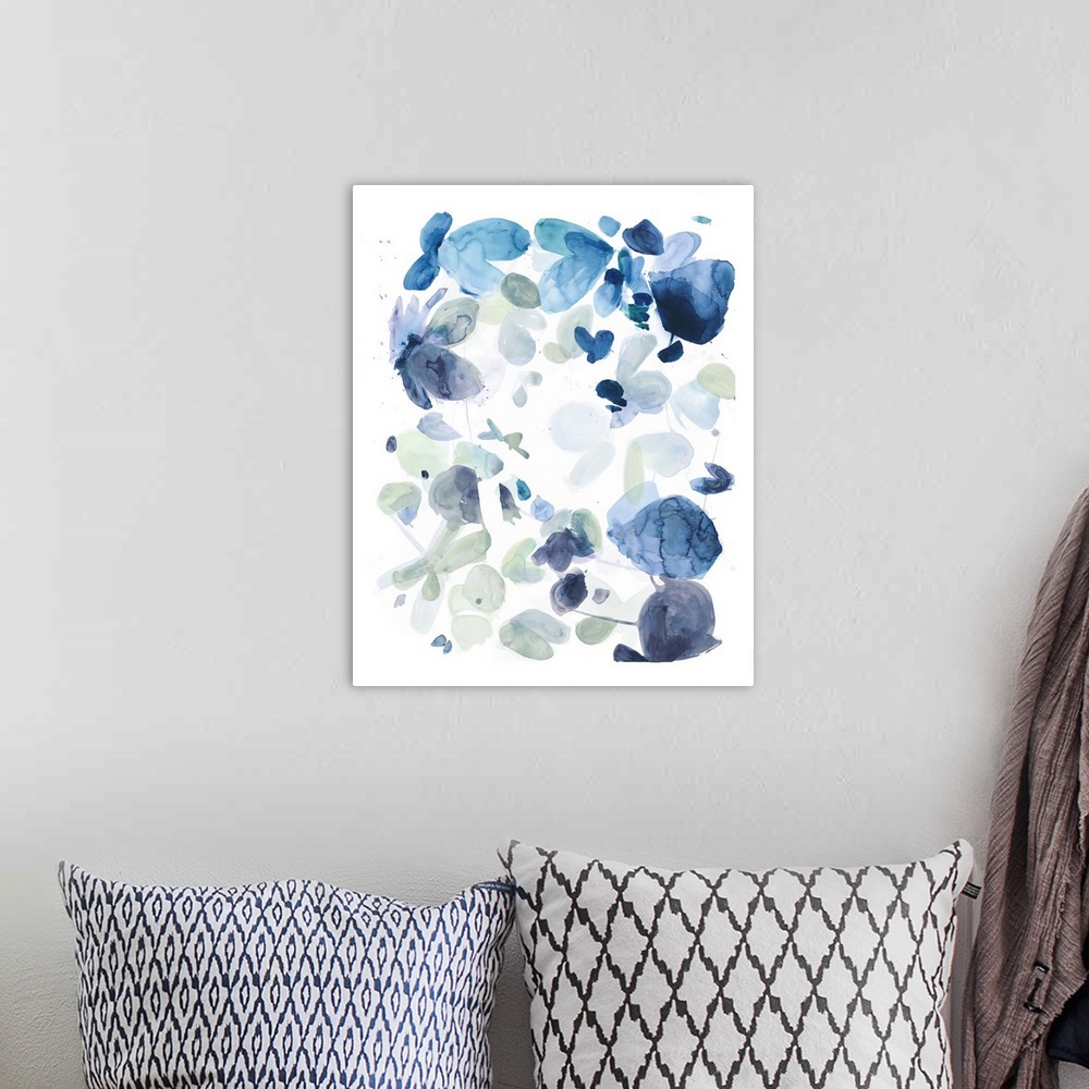 A bohemian room featuring Watercolor painting of in shades of blue on white.