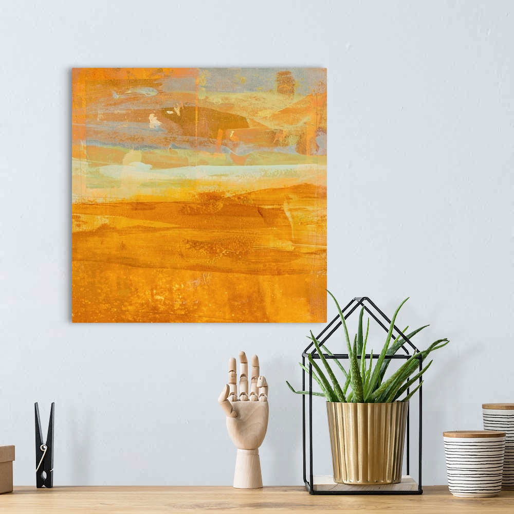 A bohemian room featuring Square abstract painting with layering  brushstrokes in shades of orange, yellow, white, and grey...