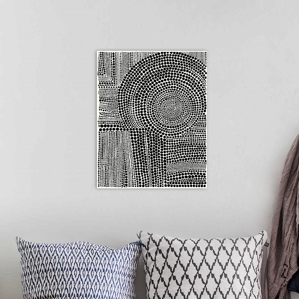 A bohemian room featuring Contemporary abstract artwork of patterns created from dots.