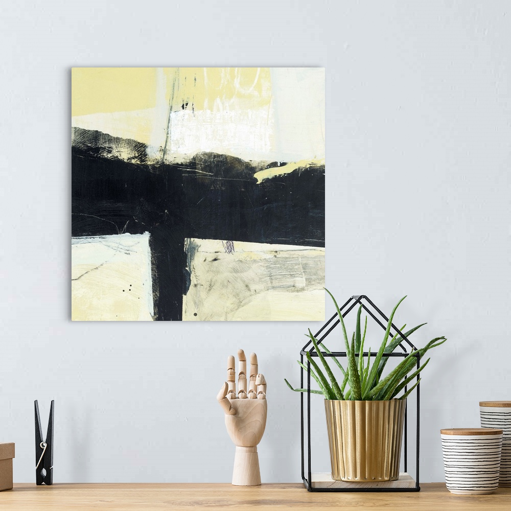 A bohemian room featuring Contemporary abstract painting using pale yellow with black bold paint strokes.