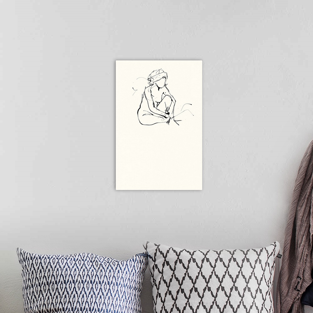 A bohemian room featuring Contemporary nude sketch of a woman using black ink on an off white background.