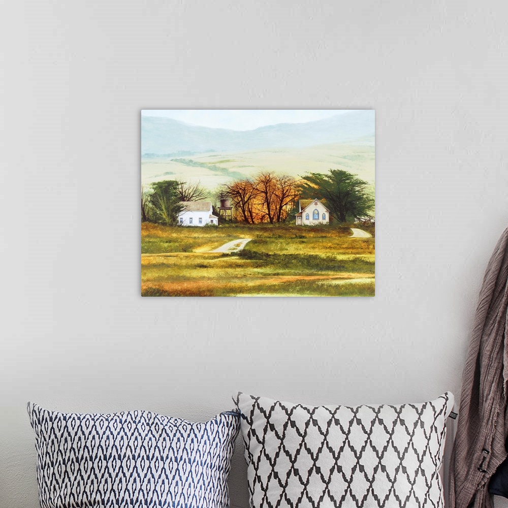 A bohemian room featuring Contemporary landscape painting of a countryside church and house with rolling hills in the backg...
