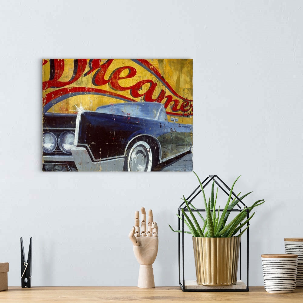 A bohemian room featuring Large landscape artwork of side angle view of a vintage convertible car, shining in the sunlight....