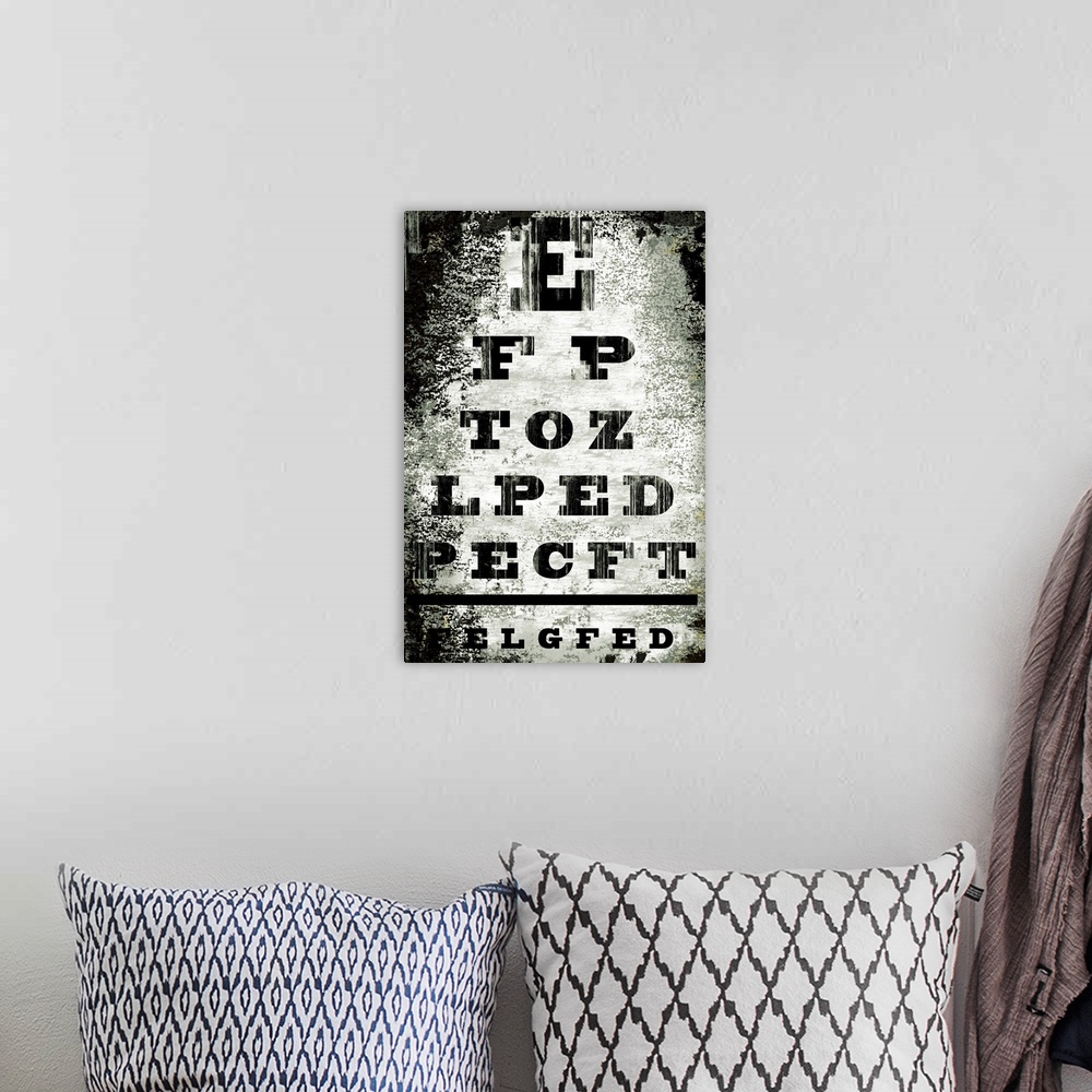 A bohemian room featuring This is an artistic and distressed recreation of a doctoros eyechart as a vertical poster.