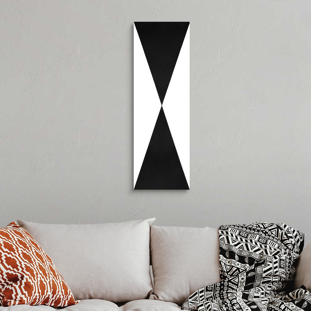 A bohemian room featuring Large abstract painting with crisp geometric shapes all meeting at one center point in black and ...
