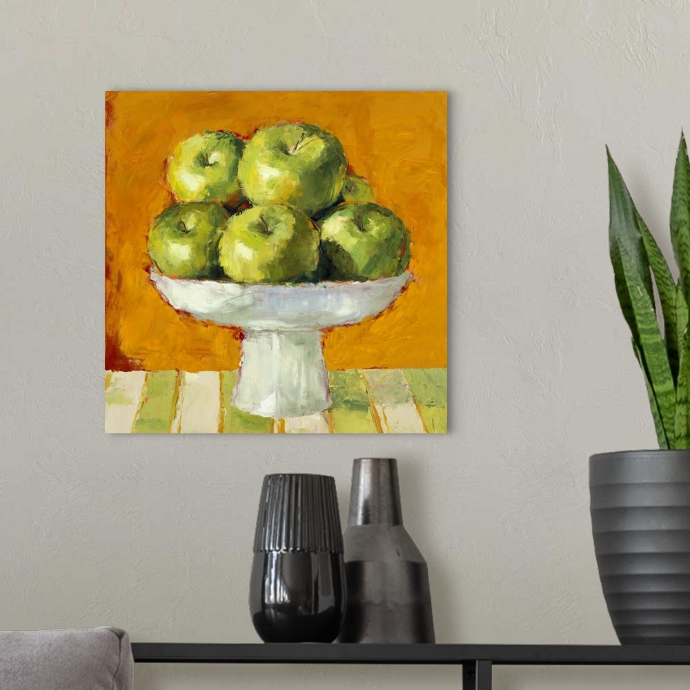 A modern room featuring Still life painting of a bowl of green apples.