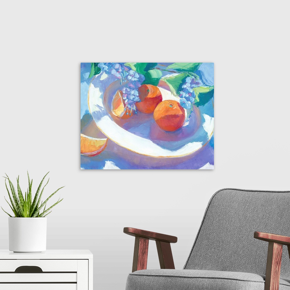 A modern room featuring A contemporary still-life painting of fruit on a plate.