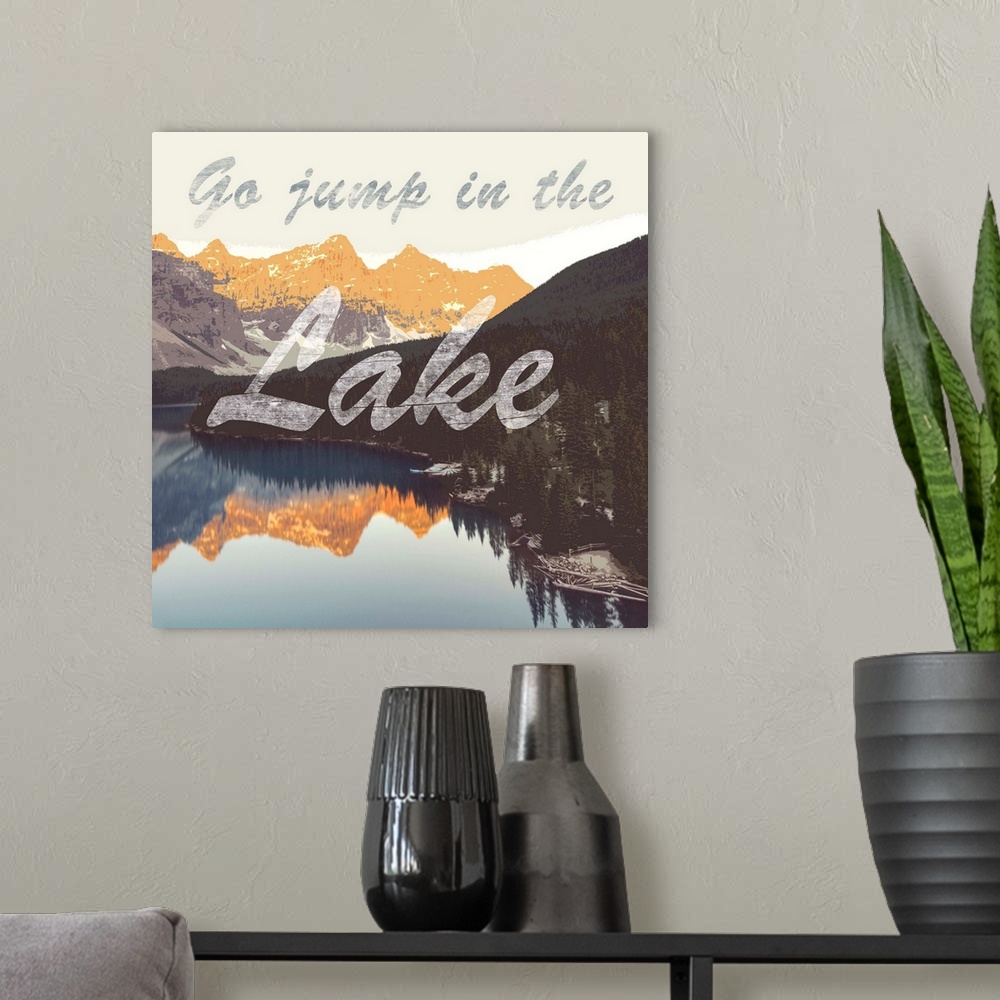 A modern room featuring The phrase "go jump in the lake" in script over an image of a mountain lake at sunset.