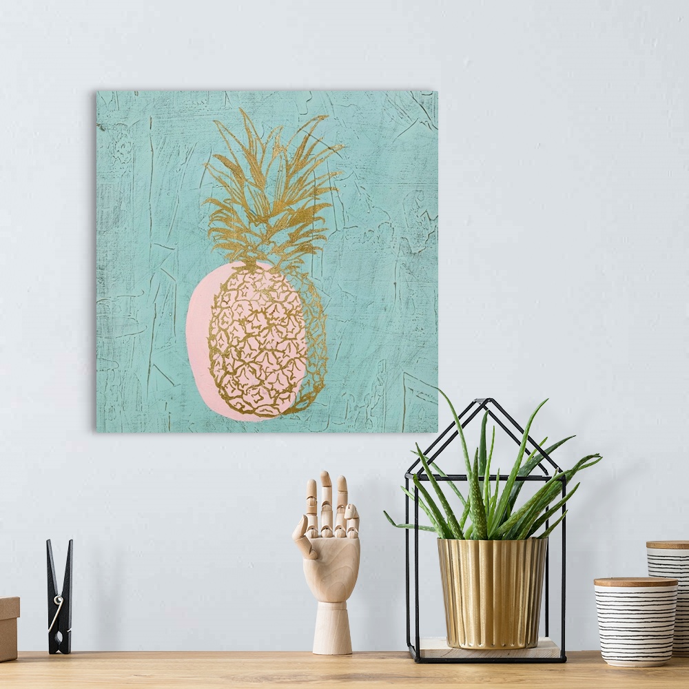 A bohemian room featuring Square painting of a metallic gold pineapple with a pink shadow on a textured teal background.
