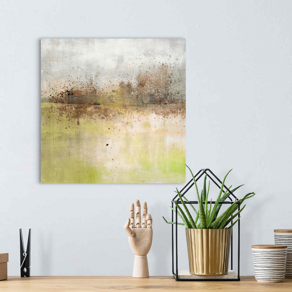 A bohemian room featuring Square abstract painting with a brown and black paint splattered horizon line with a grey and whi...