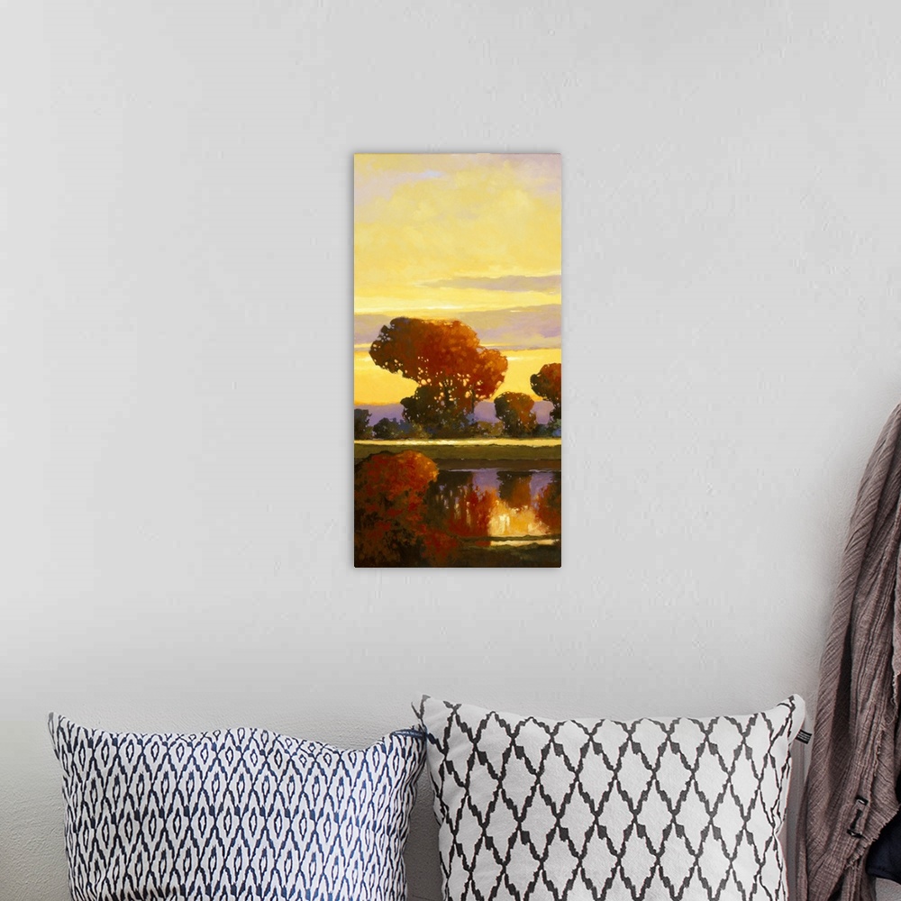 A bohemian room featuring Contemporary painting of a bright red tree reflected in a calm river.