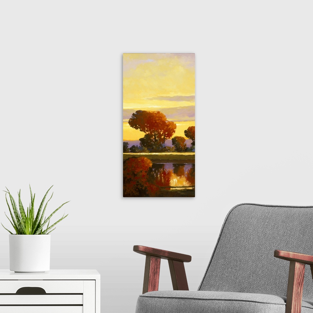 A modern room featuring Contemporary painting of a bright red tree reflected in a calm river.