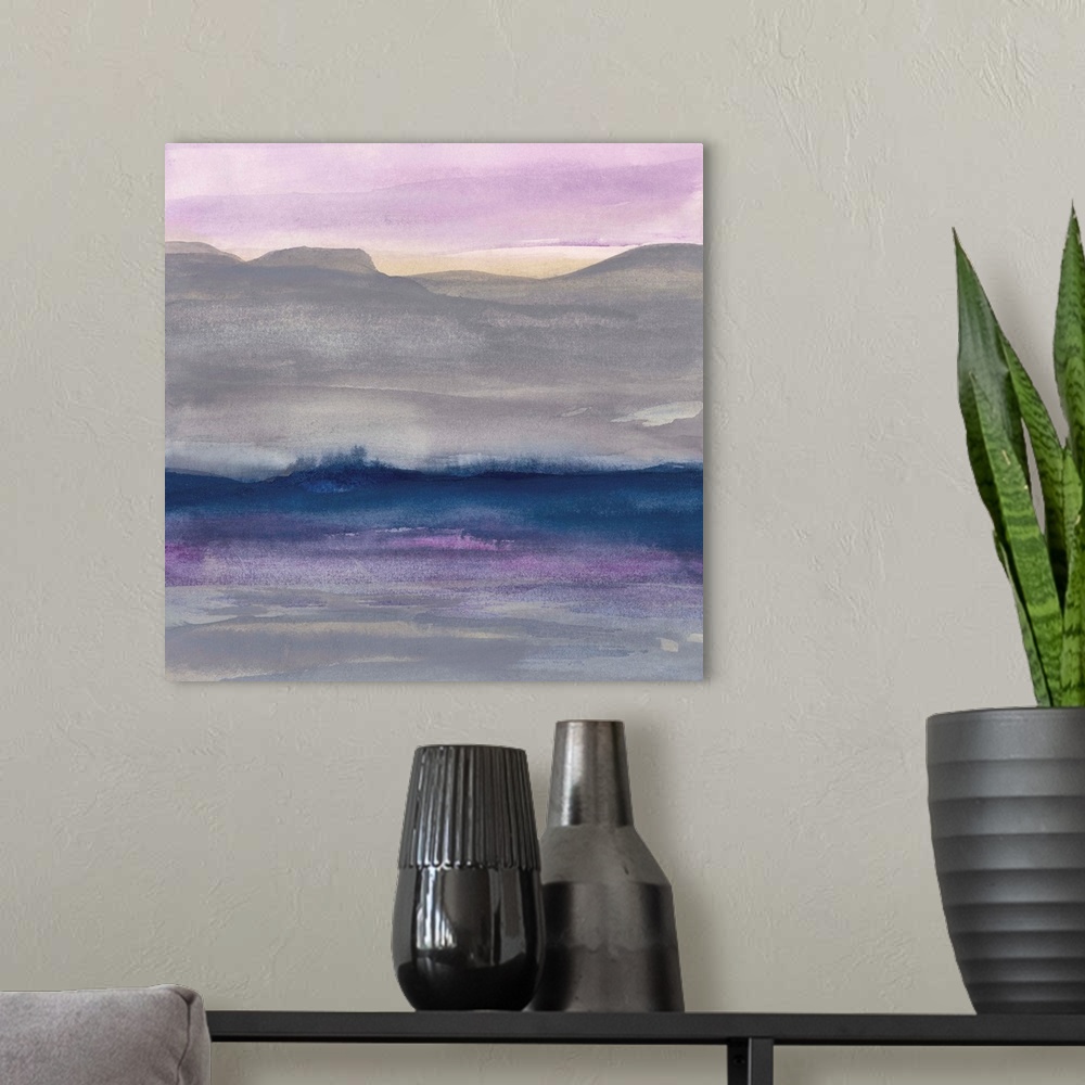 A modern room featuring Watercolor landscape painting with grey hills and a lavender sky.