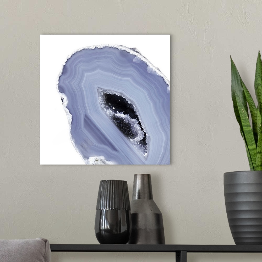 A modern room featuring A macro photograph of an agate with pale light purple and blue tones.
