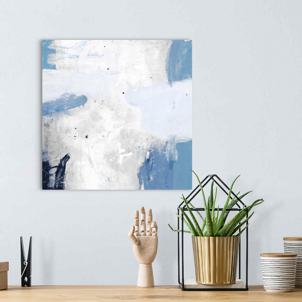 A bohemian room featuring A contemporary abstract painting using pale messy blue and white tones.