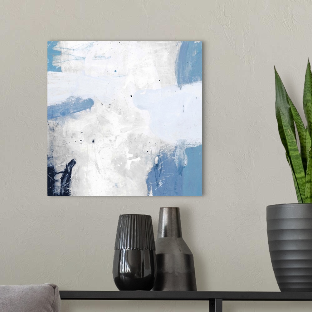 A modern room featuring A contemporary abstract painting using pale messy blue and white tones.