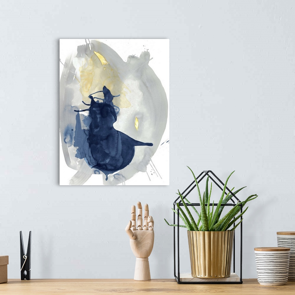 A bohemian room featuring Large abstract watercolor painting in grey, blue, and yellow hues on a white background.