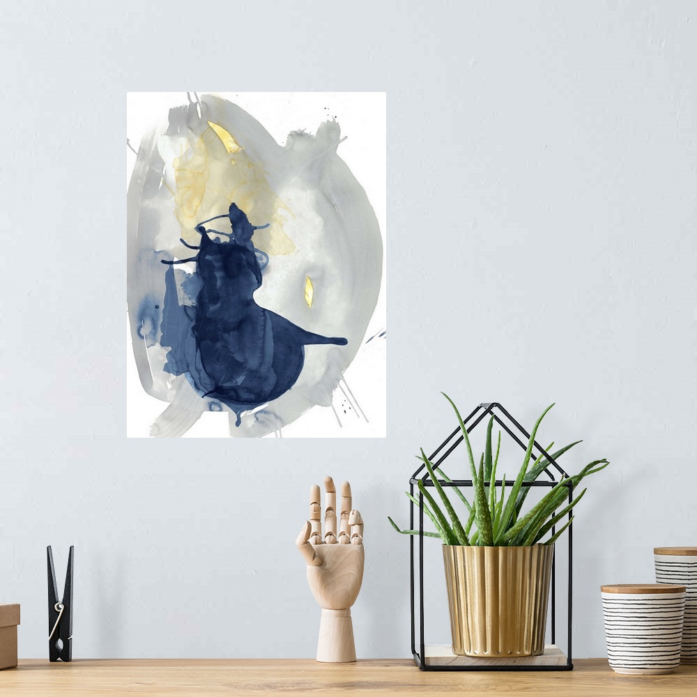 A bohemian room featuring Large abstract watercolor painting in grey, blue, and yellow hues on a white background.