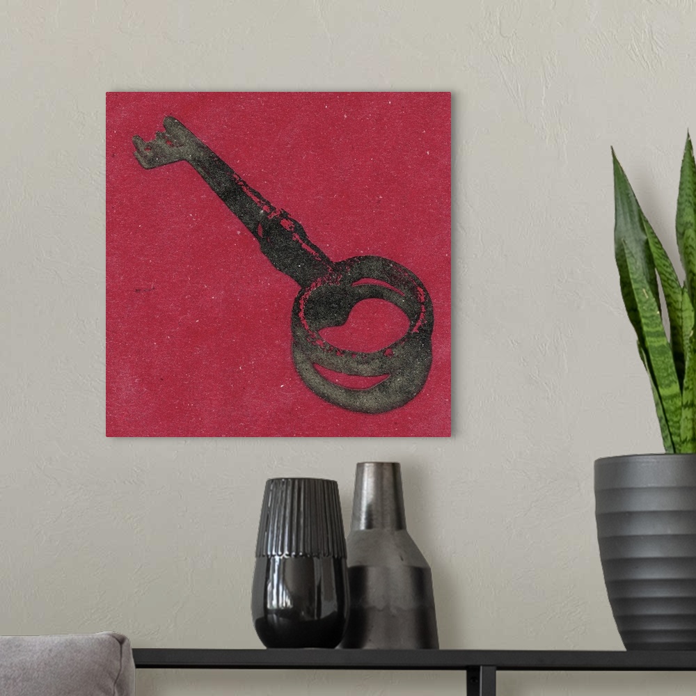 A modern room featuring Square art of an antique key on a red background.