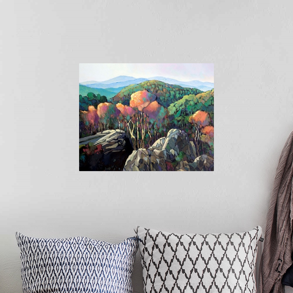 A bohemian room featuring A contemporary painting of a view looking over a forested mountain valley.