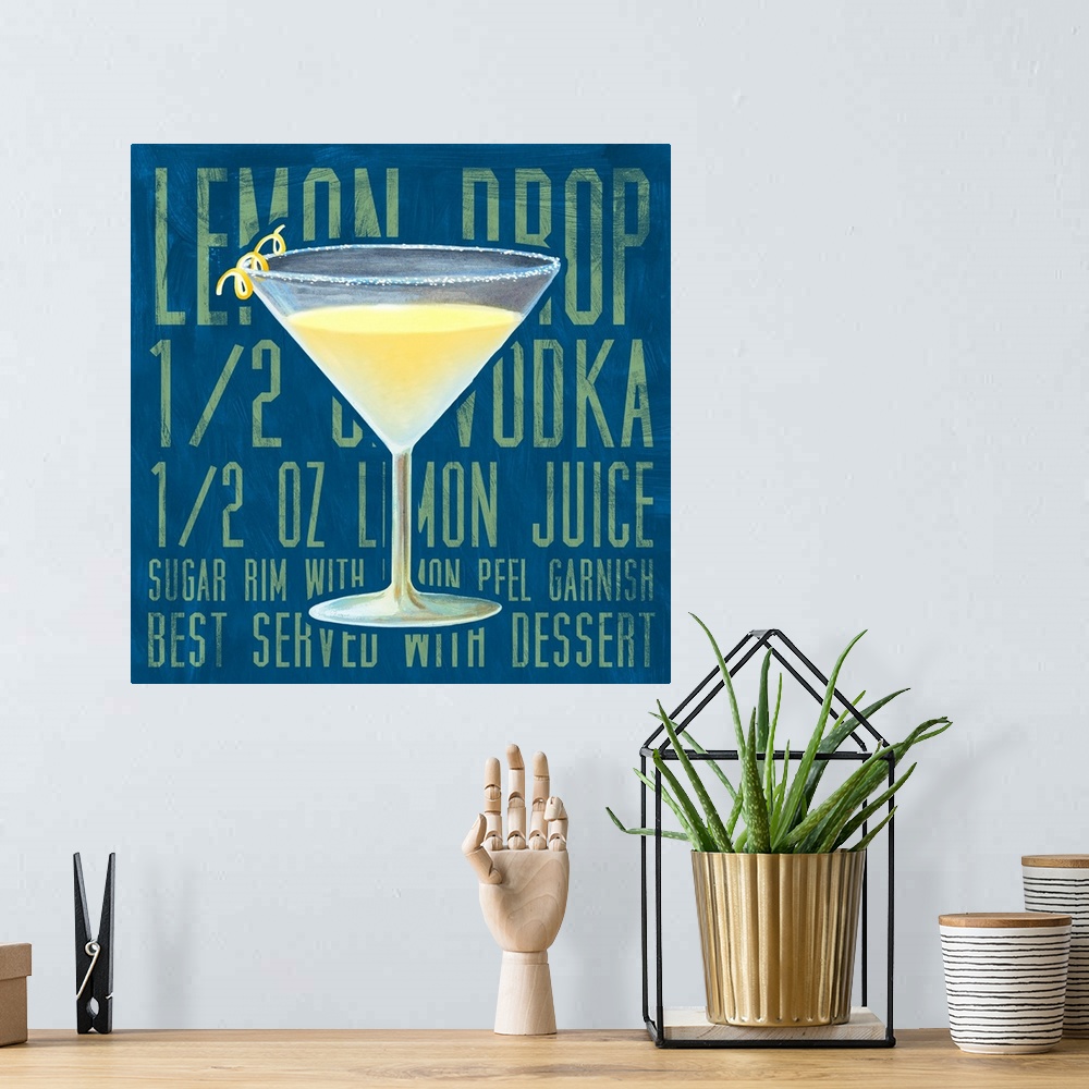 A bohemian room featuring Contemporary artwork of a cocktail against a background of the recipe to make the drink.