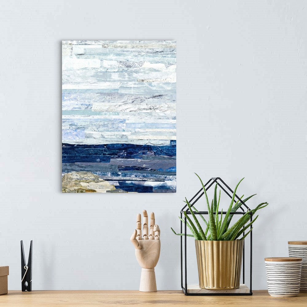 A bohemian room featuring Abstract art with strips of color pasted together to create a landscape with deep blue water, a n...