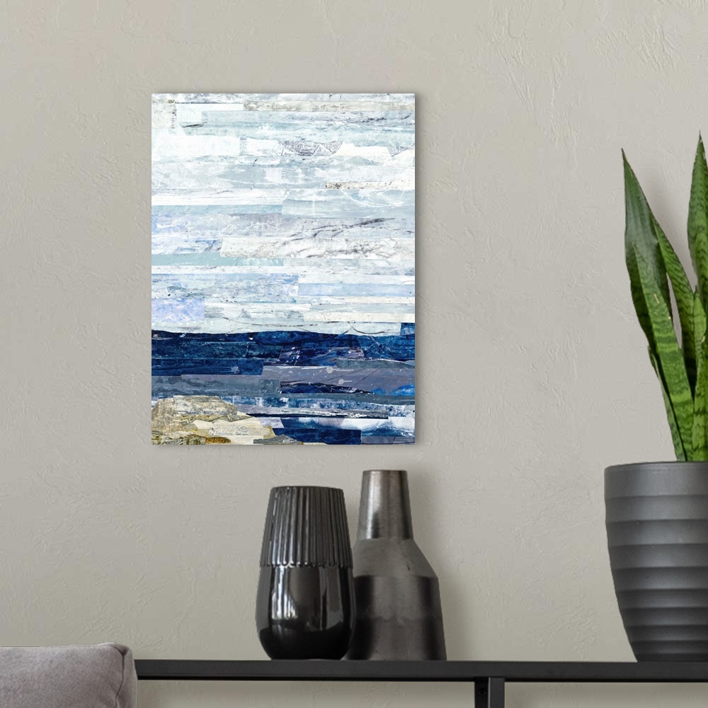 A modern room featuring Abstract art with strips of color pasted together to create a landscape with deep blue water, a n...