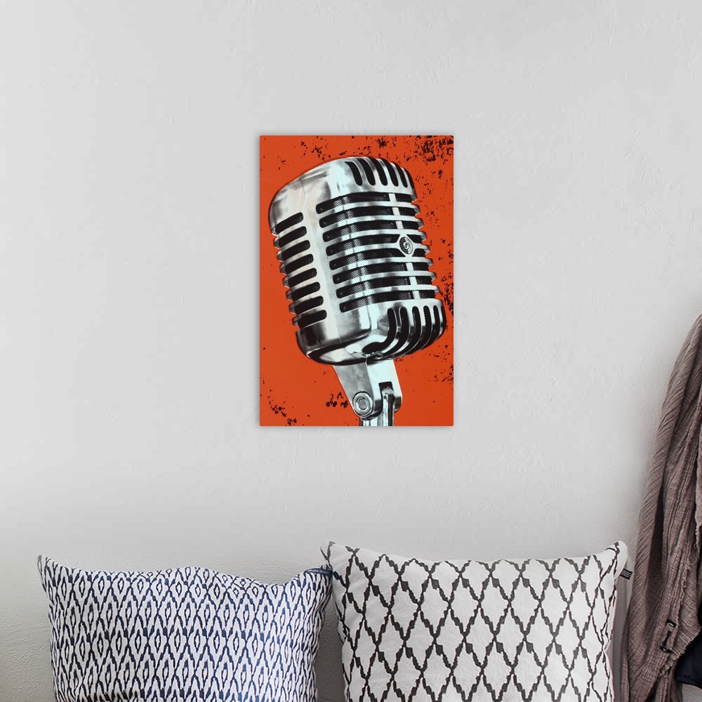 A bohemian room featuring Contemporary pop art style artwork of a microphone against a dark orange background.