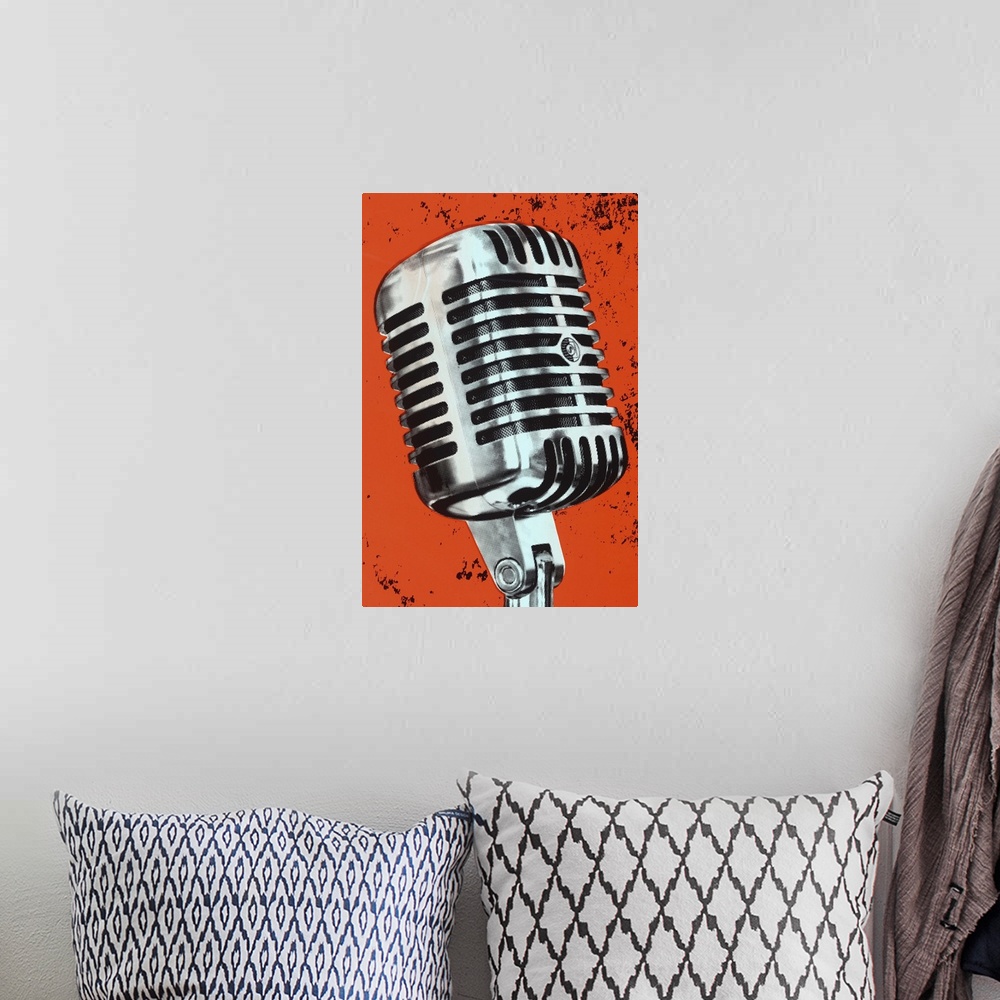 A bohemian room featuring Contemporary pop art style artwork of a microphone against a dark orange background.