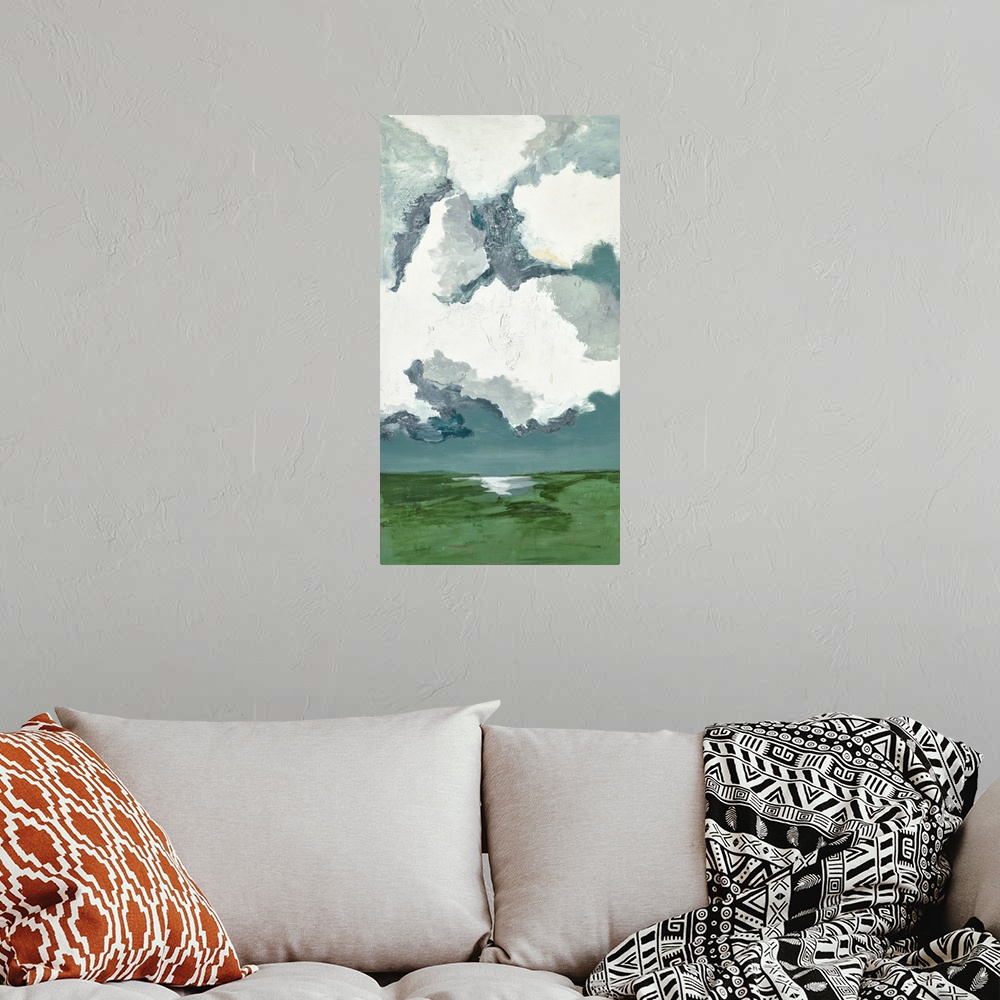 A bohemian room featuring Contemporary landscape painting with bright white clouds filling the sky.