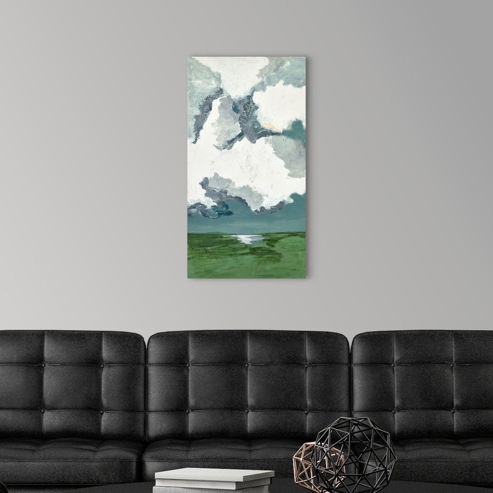 A modern room featuring Contemporary landscape painting with bright white clouds filling the sky.