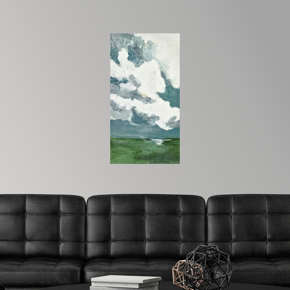 A modern room featuring Contemporary landscape painting with bright white clouds filling the sky.