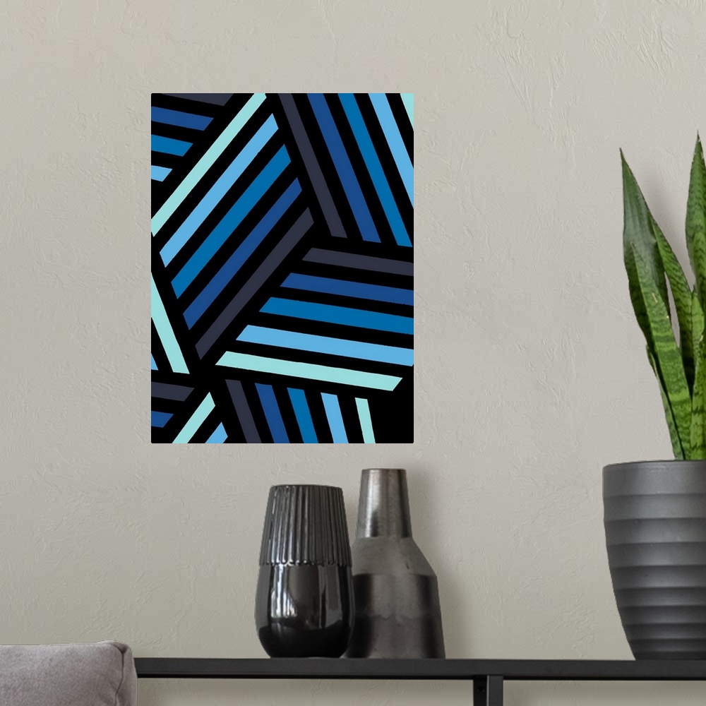 A modern room featuring Geometric abstract artwork in shades of black and blue.