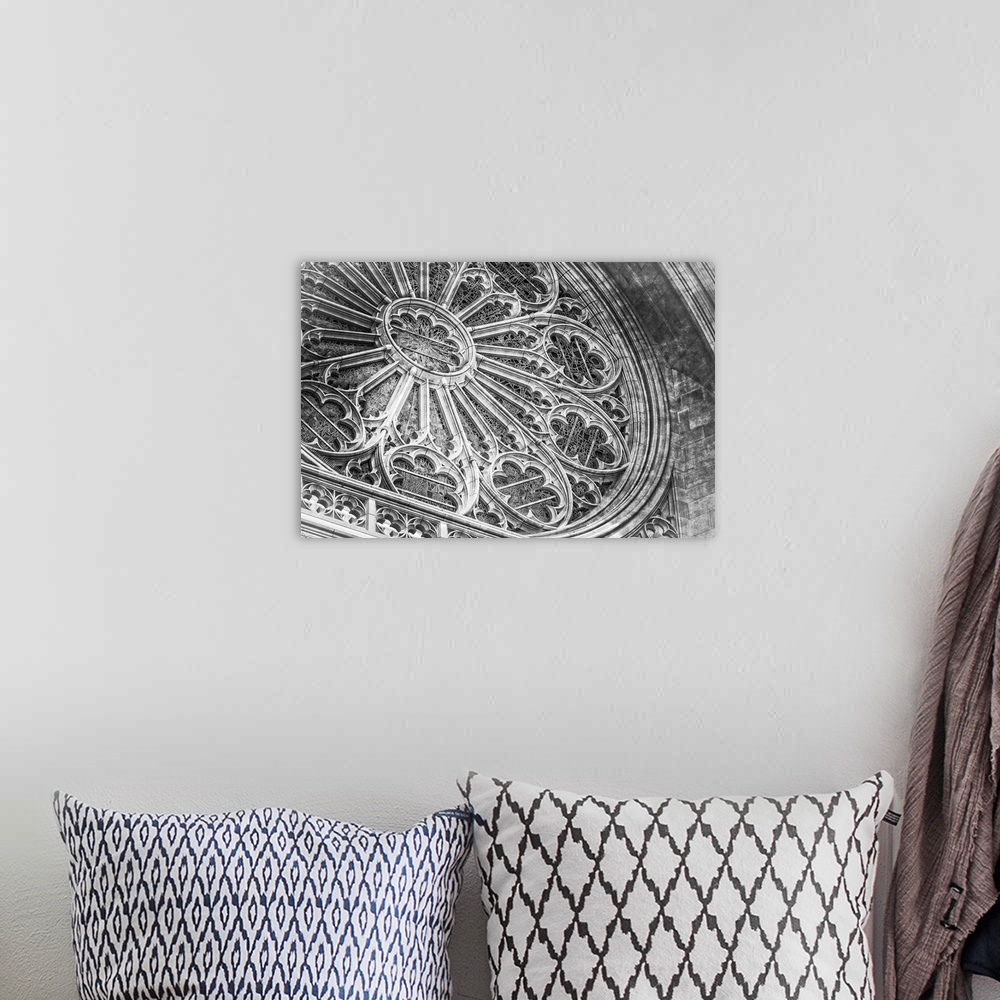 A bohemian room featuring A fine art photograph of the rose window of a cathedral.