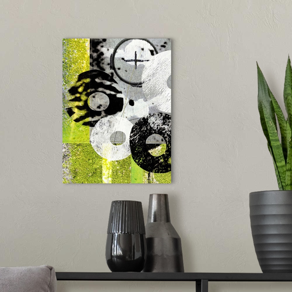 A modern room featuring A contemporary painting using circular shapes and vibrant colors with a grungy look.