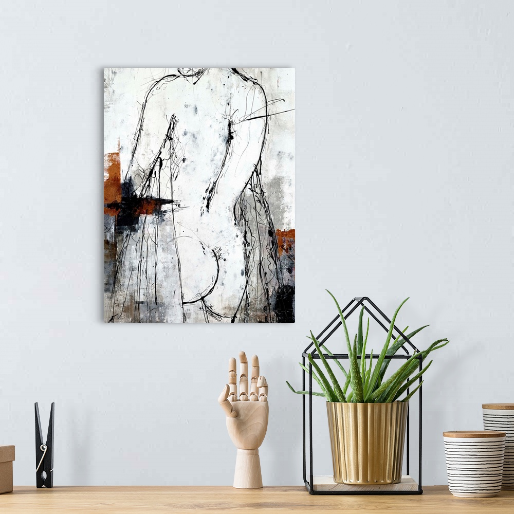 A bohemian room featuring Contemporary nude sketch in black and white with designed pops of copper and silver on the left a...
