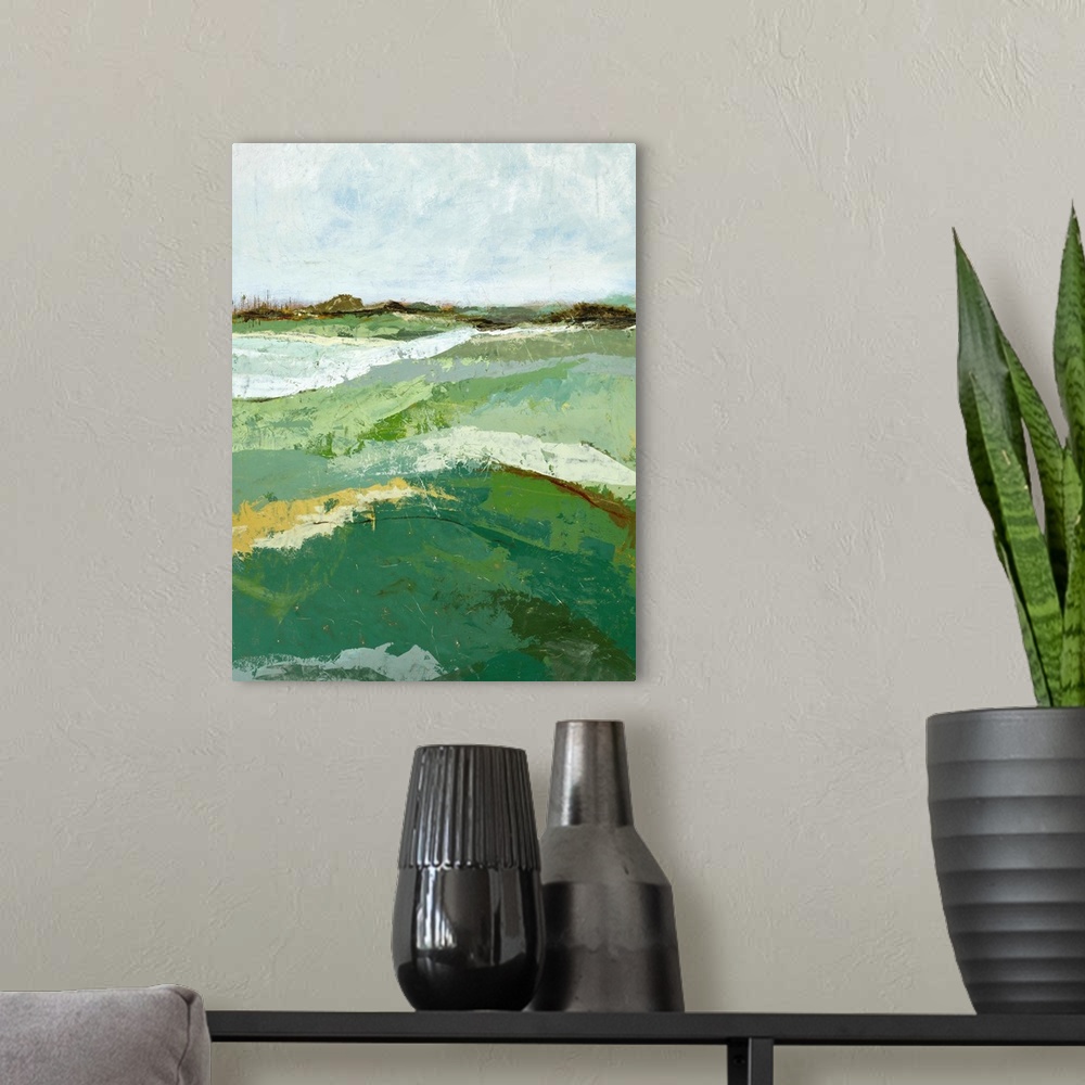 A modern room featuring Contemporary landscape painting of a green field under a gray sky.