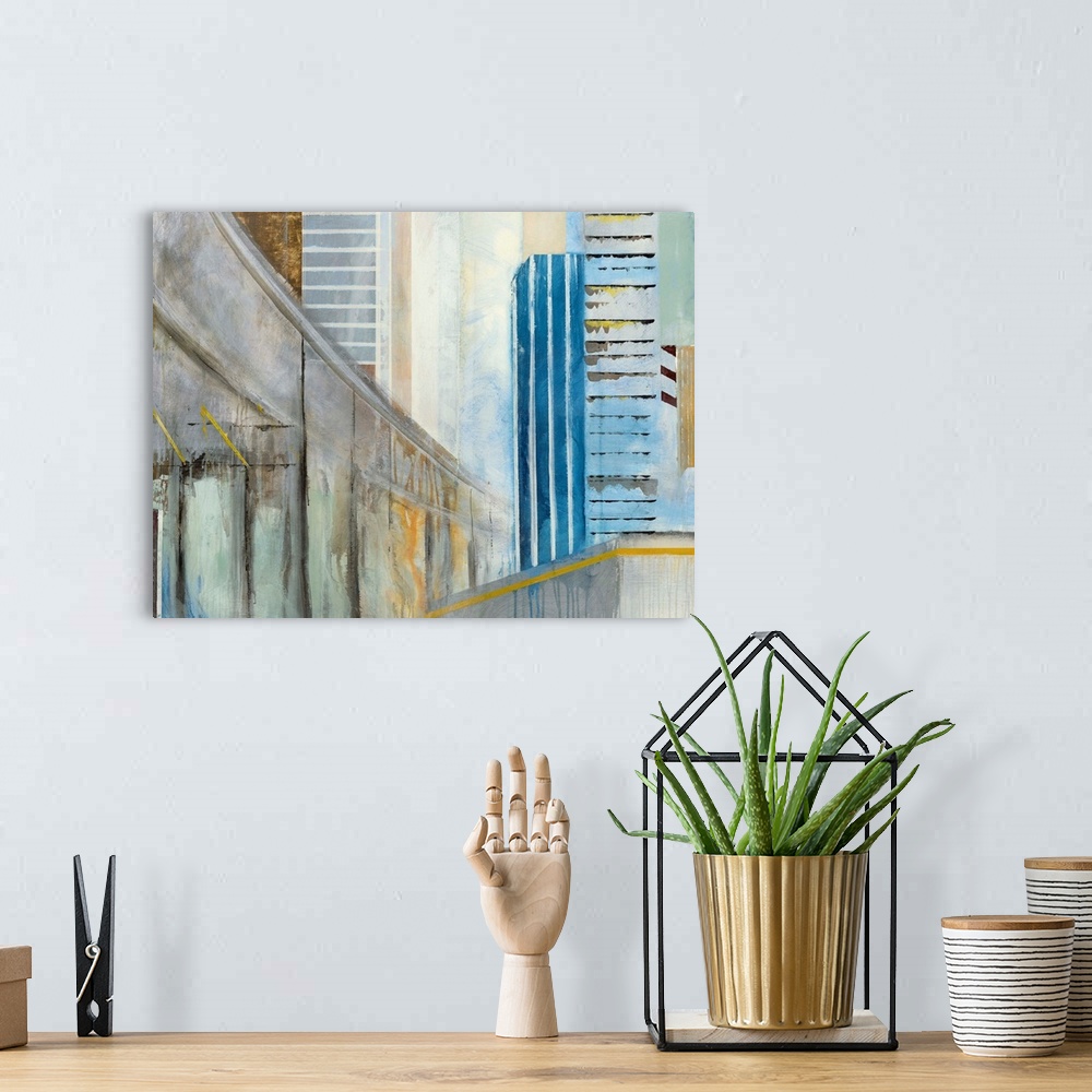 A bohemian room featuring Abstract painting of a winding overpass going through a cityscape.