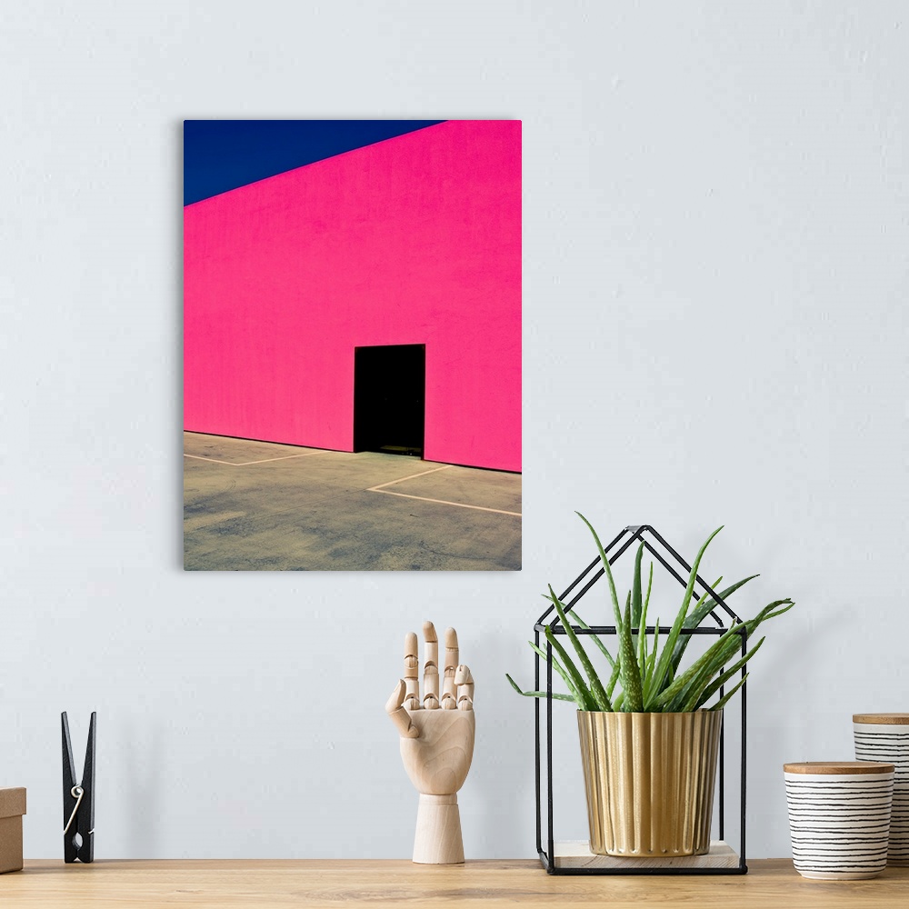 A bohemian room featuring Pink Wall Black Door