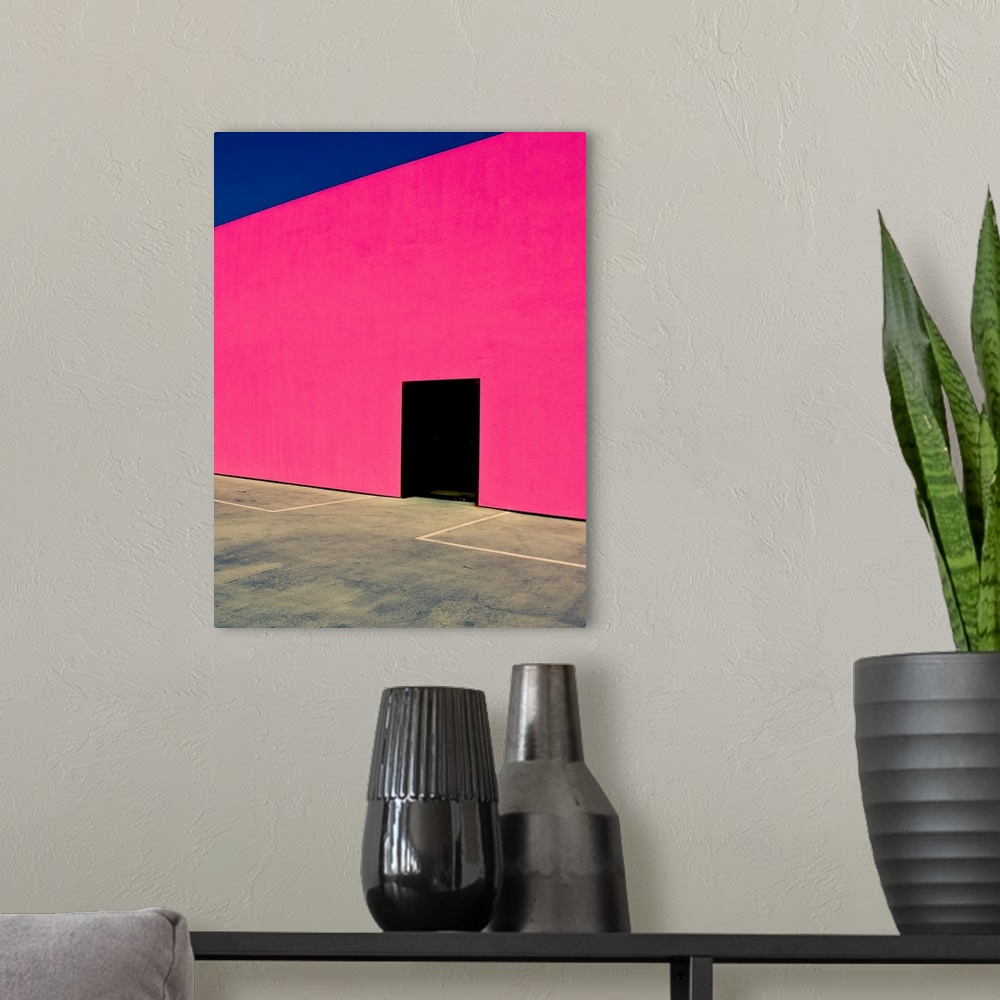 A modern room featuring Pink Wall Black Door