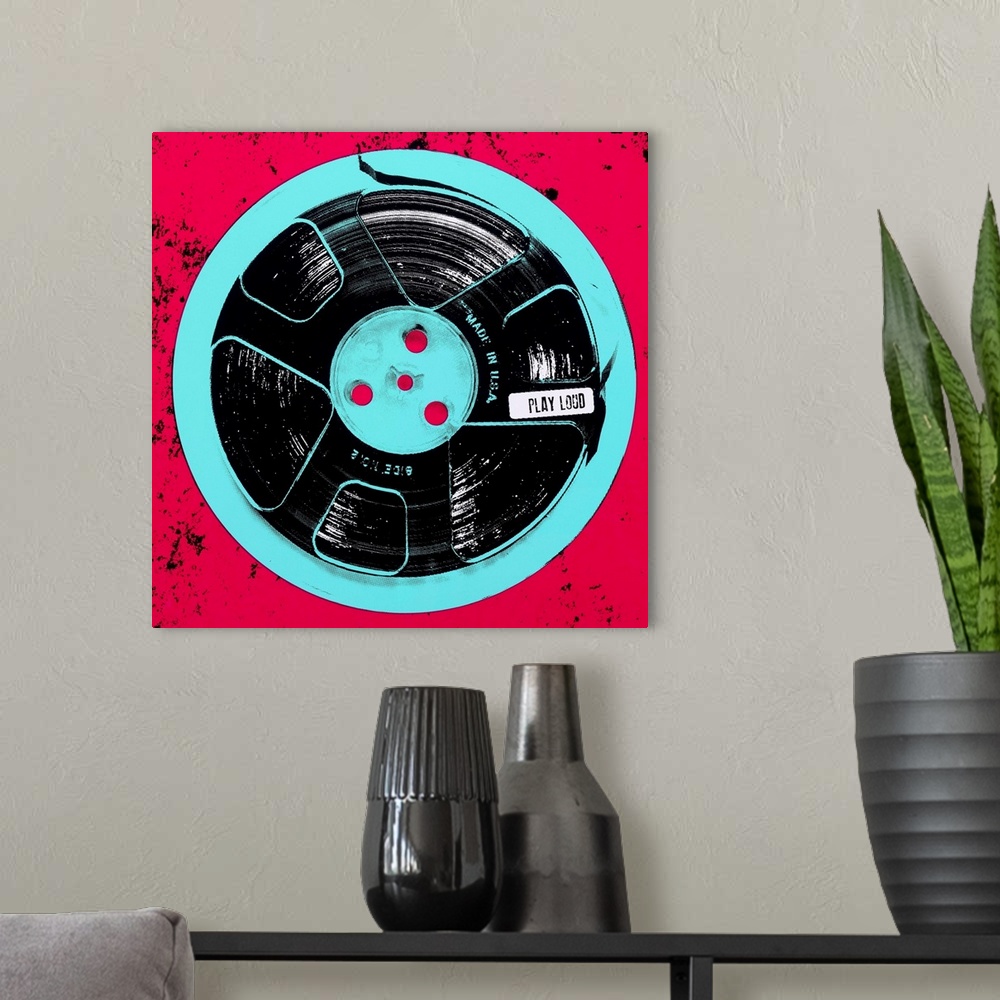 A modern room featuring Contemporary pop art style artwork of a record tape against a red background.