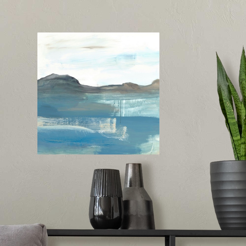 A modern room featuring Contemporary abstract painting using tones of blue and white to create a seascape.