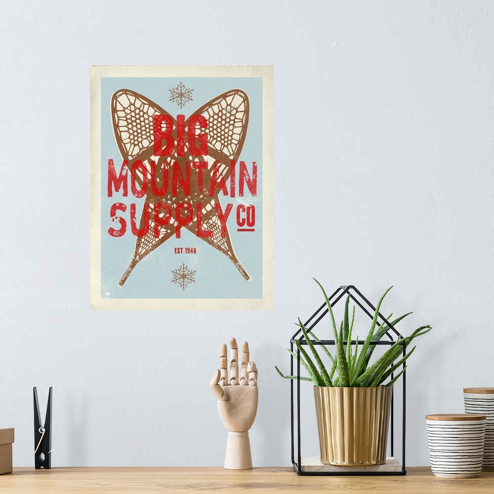 A bohemian room featuring Retro mid-century stylized travel poster artwork.